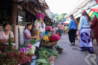 American students walking in Burmese local market.